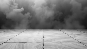 Black and white photo of a floor with a dark sky