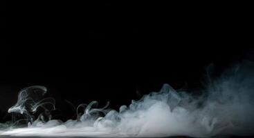 A black background with smoke coming out of it photo