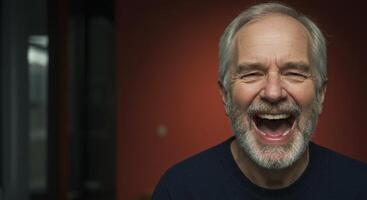 A man with a beard and white hair is laughing photo