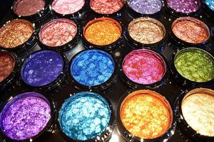 Colorful glitter eyeshadow palette showing variety of vibrant color photo