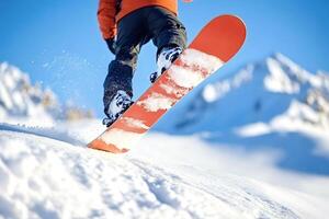 Snowboarder descending snowy mountain slope on sunny day photo