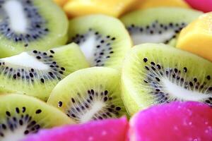 Sliced kiwi, mango and pitaya showing their freshness and vitamins photo
