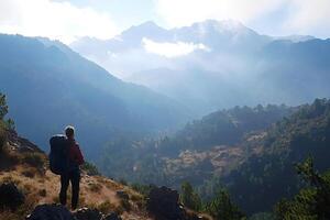 Backpacker enjoying inspiring mountain view in nepal photo