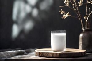 Glass of milk resting on wooden board in rustic setting photo