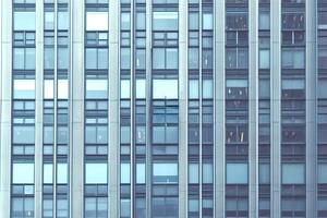Modern office building showing repeating geometric pattern of windows photo