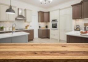 Wooden table top in kitchen with blurred background photo