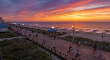 A boardwalk with people riding bikes at sunset photo