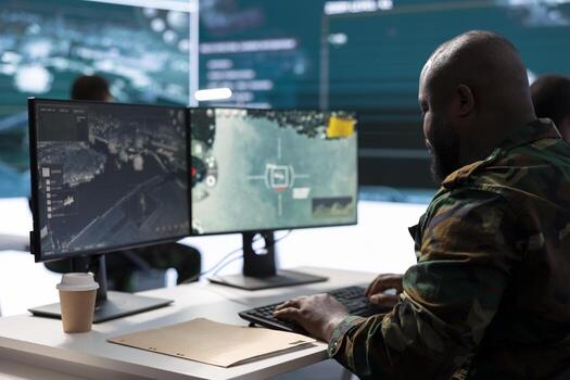 Military crew in a high tech operations room working on data processing, transmitting real time surveillance footage for crucial mission tactics. Ensuring security protocols for strategic operations. photo