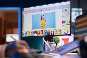 African american graphic designer working on photo retouching project on dual monitors in a modern office setting at his home. Man showcasing creativity in digital editing software.