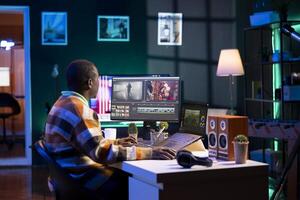 editor working on creative software to create a film montage, using color correction wheel and adding visual effects. Male creator editing gradient for movie post production, white balance. photo
