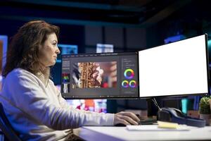 Videographer using professional software on mockup PC to create visual effects for projects. Expert using post production techniques to edit raw clips footage on isolated screen computer photo
