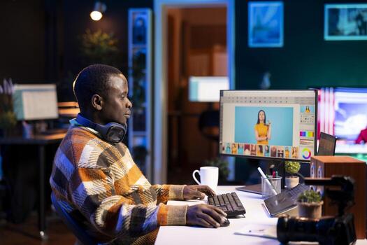 Professional man in creative setup at home using digital tools for graphic design and photo retouching, illustrating the modern tech driven design industry. Advanced tech industry.