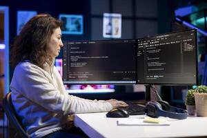 Cheerful admin satisfied after futureproofing company network from downtimes and unexpected system failures using PC. Upbeat IT expert pleased after increasing data security using computer photo