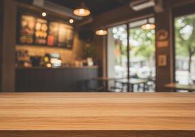Wooden table top in front of a coffee shop photo