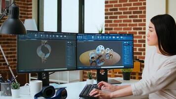 Expert engineer develops industrial prototypes using 3D modeling software at her home office, featuring dual monitors and modern office equipment perfect for innovative design processes. Camera A. photo