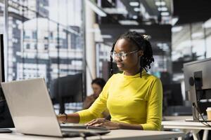 IT employee designing, developing and maintaining software applications using various programming languages. Full stack developer debugging company servers, preventing failures photo