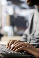 African american manager analyzing company data for strategic planning, solving resource allocation and effective business operations. Expert does financial forecasting and data analysis. Close up. photo