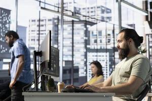 Back end developer working with machine learning tech advancing artificial intelligence critical to innovation of autonomous systems. IT expert in office transforming data into predictive models photo