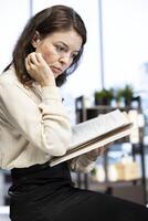 Woman CEO reviewing sales reports and market trends from analytics files, using data driven insights to adjust strategies and maximize business growth opportunities. Strategic thinking. photo