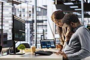 African american CEO and employee review company numbers, creating a roadmap that includes goals, strategies and resource allocation management. Specialists meet corporate objectives. photo