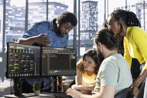 Team of developers doing brainstorming to create machine learning models that can process and analyze data to improve decision making processes. IT staff members working together in office photo