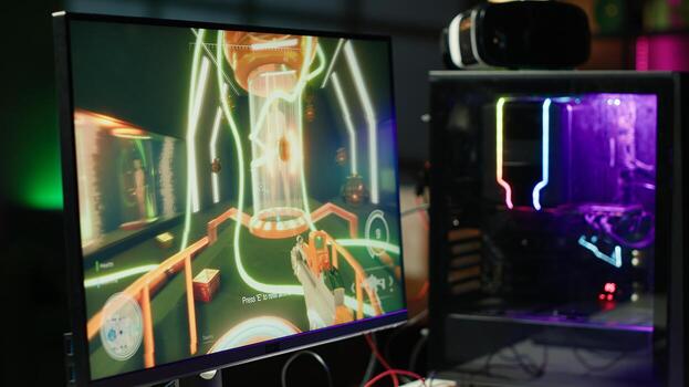 Videogame with gun and health, stamina, ammo HUDs left open on PC monitor in empty neon illuminated apartment. Close up of first person shooter game on computer display in home room late at night photo