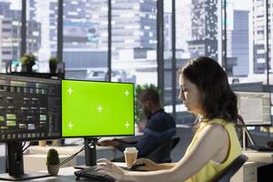 Scientist working with machine learning tech on green screen computer, advancing AI innovating autonomous systems. IT expert in office transforming data into predictive models using mockup PC photo