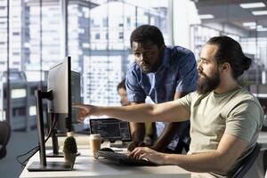 Team of programmers fixing applications issues, dealing with databases and server configuration. IT staff members optimizing company software for improved performance and scalability photo