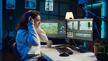 producer adds sound effects to film montage, working in studio, close up shot. Videographer using headphones to test and improve audio quality using specialized software, camera B photo