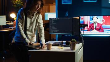 Developer holding disposable cup of coffee entering office to implement security measures, protecting company systems and data. IT worker starting job shift, testing and debugging code, camera A photo