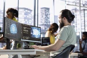 Admin using computer for artificial intelligence computing simulating human brain through self learning algorithms. Employee working with AI deep neural networks on desktop PC photo