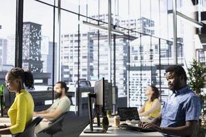 IT staff members utilizing cloud computing resources and platforms to train and deploy large scale machine learning models. Team of programmers monitoring and maintaining company systems photo