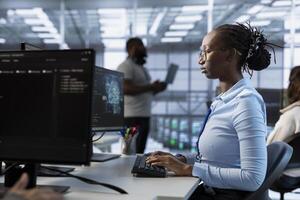 Computer scientist managing and optimizing data center infrastructure for maximum efficiency and uptime. Server hub worker maintaining optimal system performance, performing backups photo