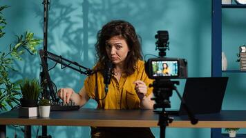 Content creator doing relaxing ASMR type of for fans, recording with professional camera. Online show host using advanced microphone and filming gear to create relaxing , camera A photo