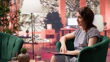 Woman opening up about her anxiety and personal troubles with therapist, discussing about her intrusive thoughts and mental health. Counselor and client sitting in therapy office. Camera A. photo