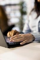 Professional business developer engages in project management at her desk, working on multinational company growth. Worker focusing on strategy planning to drive corporate success. Close up. photo