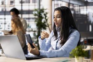 Company executive hosts an online meeting to discuss business operations and performance metrics. conference enables real time collaboration and goal setting for the enterprise. photo