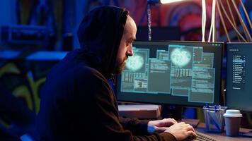 Hacker hiding in underground bunker excited after developing zero day exploit undetectable by antivirus. Malicious man successfully tricks firewalls, celebrating accomplishment, camera B close up photo