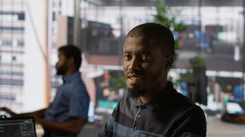 Portrait of happy programmer working with machine learning artificial intelligence critical to autonomous systems. Upbeat software engineer transforming data into predictive models, camera A photo