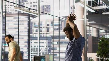 Tired admin stretches limbs while using PC for artificial intelligence computing simulating human brain. Fatigued worker relaxing back, feeling strained after working with AI neural networks, camera A photo