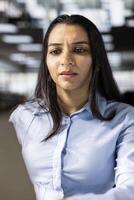 Professional business developer engages in project management at her desk, working on multinational company growth. Worker focusing on strategy planning to drive corporate success. photo