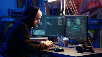 Hacker in hidden base excited after successfully getting past anti tamper measures implemented by companies to protect their products. Joyous cracker celebrating after managing to pirate software photo