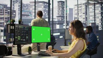Admin using multi monitor green screen PC to create machine learning models that can process data to automate decision making processes. Woman programming using chroma key computer photo