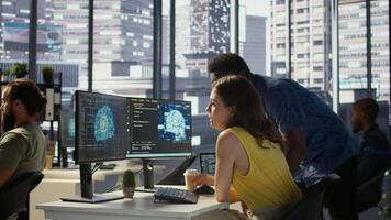 Employee using AI technology to design algorithms that enable machines to learn from data. Admin in office training large scale deep learning models with artificial intelligence tech, camera B photo