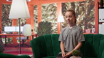 Teenager at therapy session struggling with emotional issues. Counseling meeting focuses on adolescence, mental health and social media impact on mental well being. Psychotherapy support. Camera B. photo