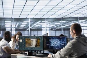Team of programmers in server room making generative artificial intelligence website generating videos using diffusion models. Teamworking colleagues coding AI virtual assistant producing clips photo