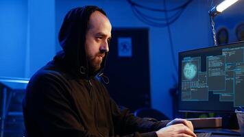 Hacker excited after finally developing zero day exploit undetectable by antivirus software installed on systems. Rogue programmer happy to successfully trick firewalls, celebrating accomplishment photo