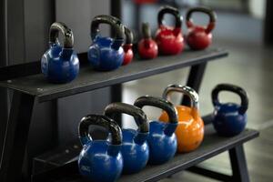 A pair of dumbbells neatly arranged in the gym, ready for a powerful workout session to build strength and endurance photo