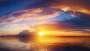 Sunset over the ocean with clouds and water photo