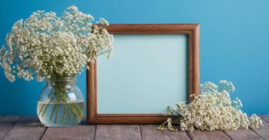 Photo frame with baby's breath flowers on wooden table
